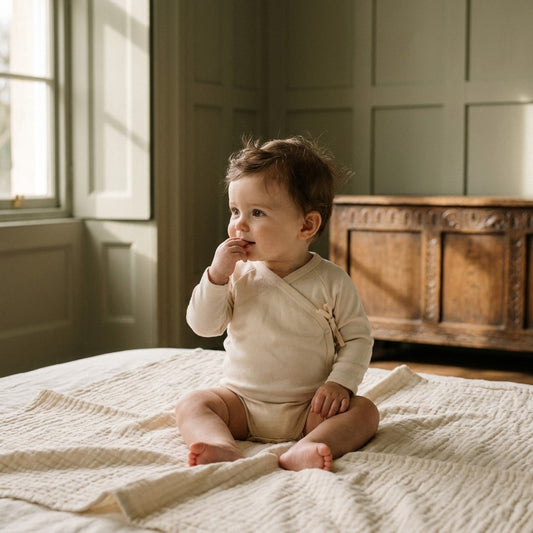 Caico Cotton lifestyle — Baby Wrap Bodysuit Alabaster