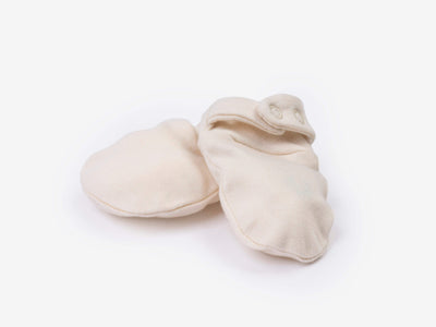 Newborn crossover bodysuit in alabaster organic Egyptian cotton, front view